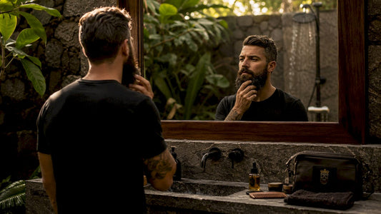 Man examining coarse beard in bathroom mirror