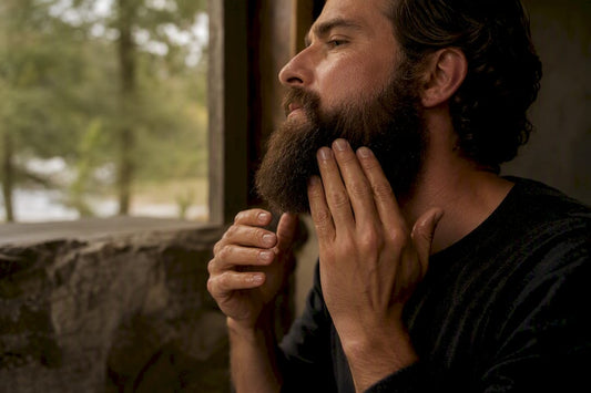 Man applying unscented beard oil to coarse beard